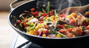roaster pan with a melody of cooked vegetables